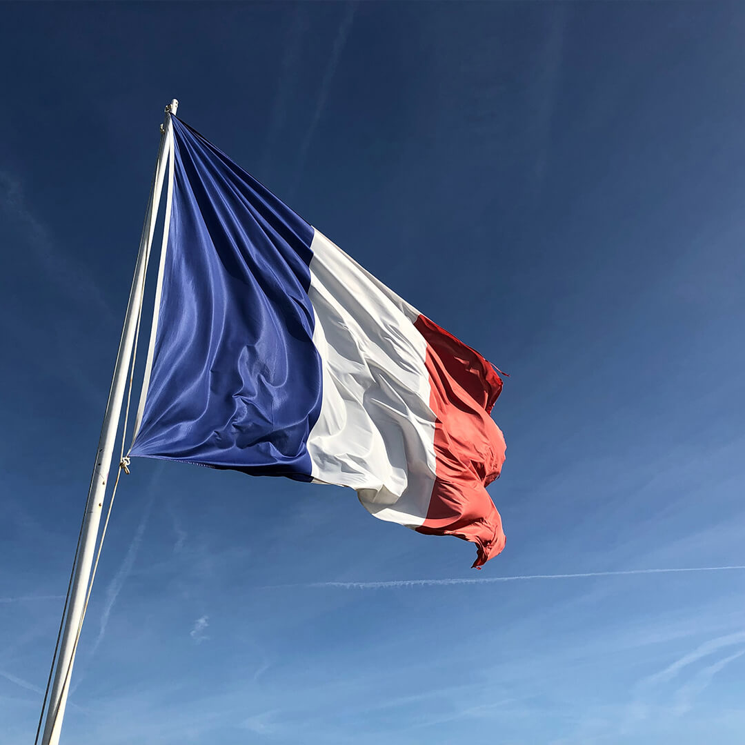 The French flag blowing in the wind.